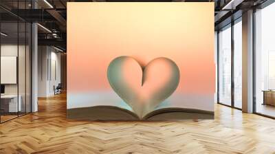 Close up of heart shape of open hardback book, copy space, soft yellow orange background, selective focus/ love concept of Valentine's day, book, heart from sheets of paper/ love with open book heart Wall mural