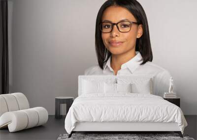 Studio portrait of successful african american businesswoman wearing white collar shirt and glasses. Confident black female entrepreneur smiling look in camera. Woman leader and business owner concept Wall mural