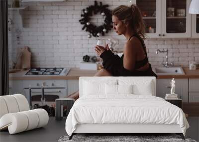 New year photo session of a young girl. Sexy blonde. Cozy atmosphere in the kitchen. Wall mural