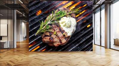 steak on a grill fire, with herbs and butter Wall mural