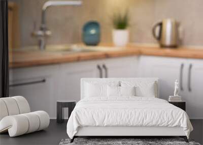 Focus on a white wooden table and scandinavian kitchen Wall mural