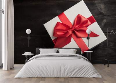 white gift box with red ribbon Wall mural