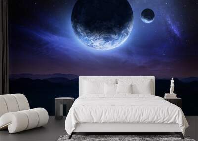 Dark blue space art with landscape and planets in the sky. Mountains and clouds. Elements of this image furnished by NASA Wall mural