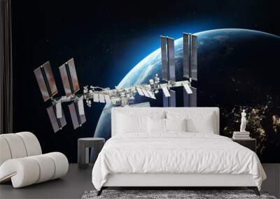 ISS space station on orbit of the Earth planet. Blue light on background. Elements of this image furnished by NASA Wall mural