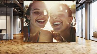 Two beautiful young girls with wet hair and drops of water. Wall mural