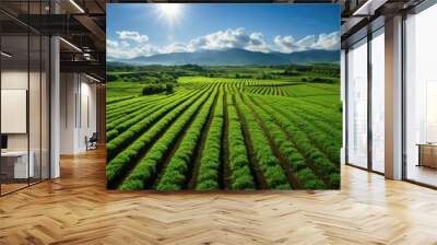 A panoramic vista reveals a sprawling green farm bathed in sunlight, with distant mountains completing the scenic view. Photorealistic illustration Wall mural