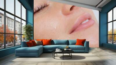 The procedure of steaming the skin of the face of a young woman before cleaning the skin in a cosmetology salon. Wall mural