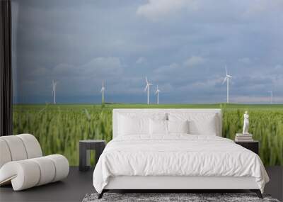 wind turbines in field with blue sky and clouds Wall mural