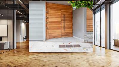 modern house entrance natural wood door by the sidewalk and tree Wall mural