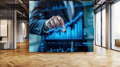 Business growth concept with hand touching rising digital graph on futuristic interface. Wall mural