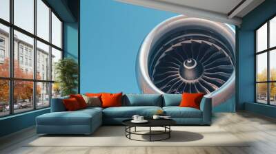 A close-up of an airplane engine with a clear blue sky in the background, highlighting the power and technology of aviation Wall mural