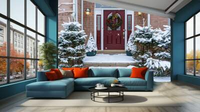 building entrance group. beautiful chic minimalist home decor of a front yard with small christmas trees and burgundy front door with a festive wreath Wall mural