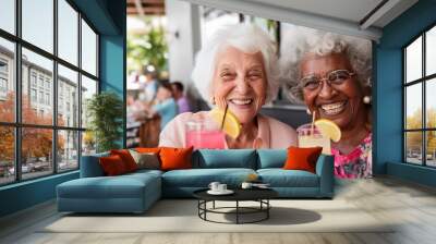 diverse senior women drinking cocktails in hotel, traveling on vacation or on cruise. Wall mural