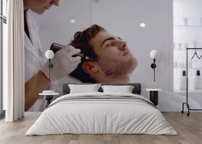 man patient  in beauty salon doing procedure or treatment. Skincare routine. Face closeup.  Wall mural