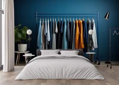 minimal rack with blue color palette male clothes on hangers. open closet, dressing room for wardrob Wall mural