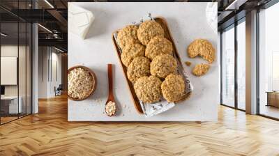 Breakfast with healthy oatmeal cookies on stone background. Top view, flat lay. Cereal biscuits recipe Wall mural