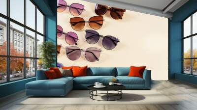 Different sunglasses on yellow background. Summer banner. Copy space. Optic shop Wall mural