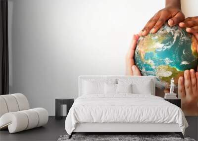 Group of diverse people holding Earth globe in hands banner, symbolizing unity, diversity, global cooperation and politics, Earth protection, world peace, ecology. Earth day poster. Copy space Wall mural