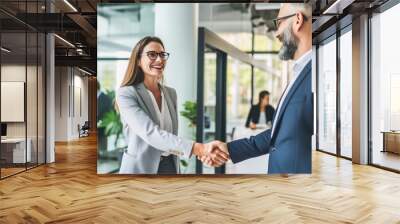 man and woman shaking hands. Happy business people, handshake and meeting in teamwork for partnership or collaboration in boardroom. Woman shaking hands in team recruiting, introduction, b2b agreement Wall mural