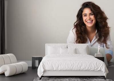 Online courses, distant education, work banner. Smiling beautiful young brunette woman 20s working on laptop pc computer at a desk on light grey background. Young smiling business woman. Copy space Wall mural