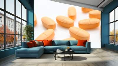 orange pills over white Wall mural