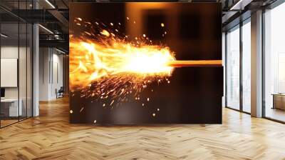 A close-up shot of a matchstick burning brightly, creating a fiery spectacle with sparks and flames. Wall mural