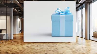 Light blue gift box with a blue ribbon bow on a white background. Wall mural