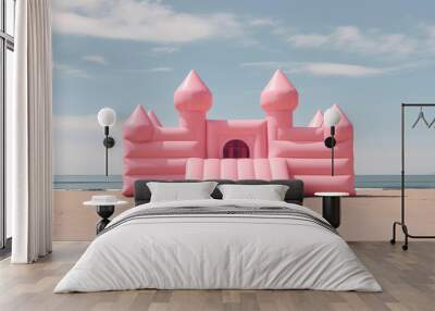 Big Inflatable Pink bounce castle on a sandy beach against blue sky, minimal style summer wallpaper, nobody. Sea beach vacation, fun activity for kids. Wall mural