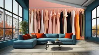 Fashionable women's closet wallpaper. Summer closet, dresses and shirts on hangers. Creative concept of women's clothing showroom, designer dresses store. Wall mural