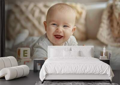 Joyful Baby with Alphabet Blocks. Cheerful baby playing with colorful letter blocks, joyful early learning English language concept, copy space. Wall mural