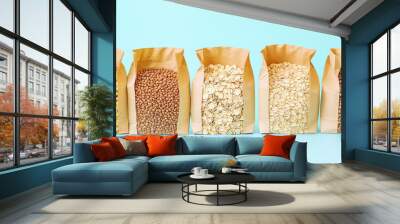 Paper bags with different types of grains and cereals. Background variety of grains, groceries, side dishes Wall mural