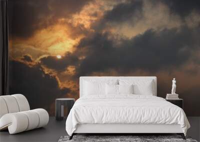 Beautiful sky with sun rays and dark clouds before sunset Wall mural