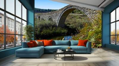 View of the traditional stone bridge of Pramoritsa near Grevena in northwestern Greece Wall mural