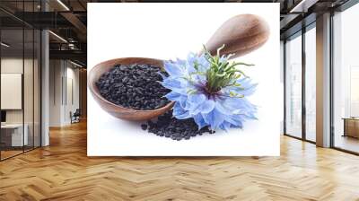 Black cumin seeds with nigella sativa flower on white background Wall mural