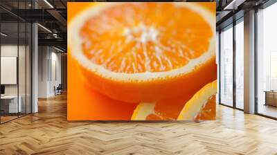 Close-up of fresh orange slices showcasing vibrant color and texture. Wall mural