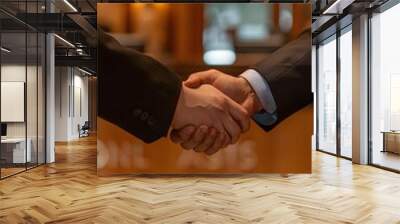 Close-up of two businessmen shaking hands in a luxury hotel lobby Wall mural