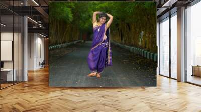 Indian Traditional Beautiful young girl in saree posing outdoors Wall mural