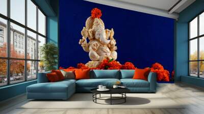 Hindu God Ganesha. Ganesha Idol on blue Background.
 Wall mural