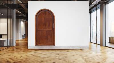 Classic arched wooden door on white wall. Wall mural