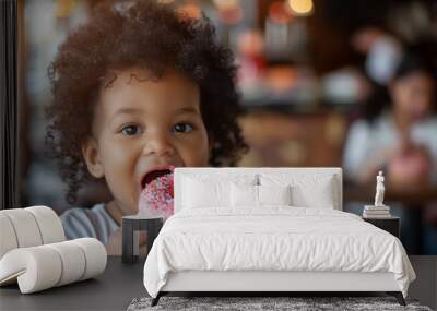 copy space, stockphoto, happy black toddler eating a donut, national donut day theme. Happy black african-american child with a donut. Colorful image. Sugar food. Child is having a good time, unhealth Wall mural