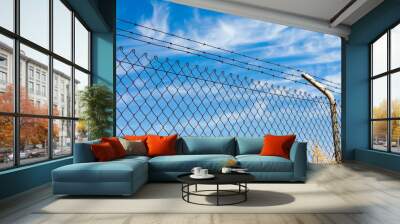 Mesh fence with barbed wire Wall mural