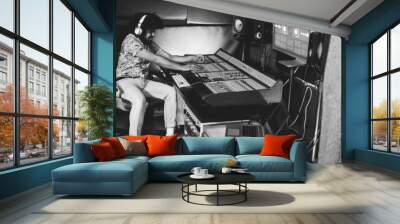 African music producer mixing new music album inside boutique studio - Focus on right hand - Black and white editing Wall mural