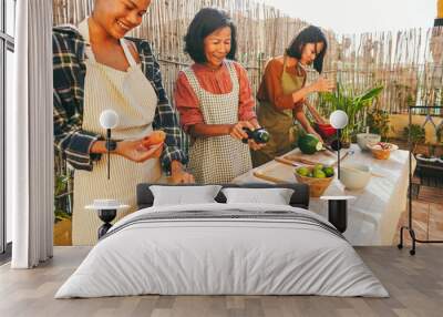 Asian family cooking together at home patio outdoor - Mother and two daughters having fun preparing dinner at house backyard - Main focus on center woman face Wall mural