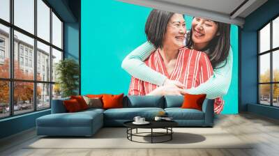 Asian mother and daughter having fun outdoor - Happy family people enjoying time togehter - Love, parenthood lifestyle, tender moments concept - Focus on mom face Wall mural