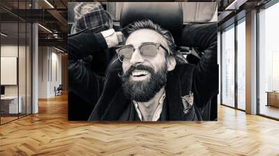 Fashion portrait of young bearded hipster man  Wall mural