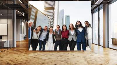 Group of multiethnic business people celebrating outdside of the office with financial  city in background - Corporate colleague and finance concept -  Main focus on center etrepreneurs faces Wall mural