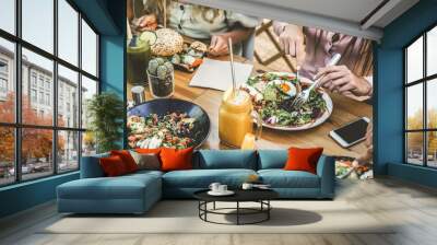 Hands view of young people eating brunch and drinking smoothies bowl with ecological straws in plastic free restaurant - Healthy lifestyle, food trends concept - Focus on top fork dish Wall mural