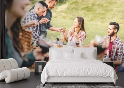 Happy adult friends eating at picnic lunch in vineyard outdoor - Young people having fun on gastronomic weekend tuscany tour - Friendship, summer and food concept - Focus on  center blond girl Wall mural