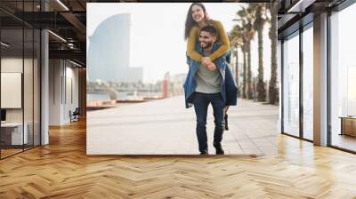 Happy couple having fun outdoor in barcelona city - Soft focus on man face Wall mural