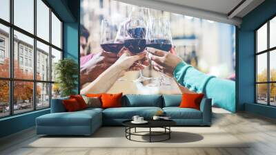 Happy friends cheering with red wine inside trendy winery bar Wall mural